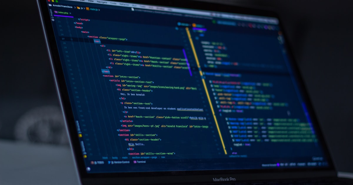 Developer debugging JavaScript code on a laptop
